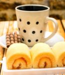 Orange Cakes Coffee Indicates Swiss Rolls And Break Stock Photo