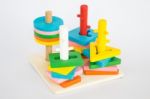 Colorful Puzzle Wooden Toy On White Table Stock Photo