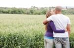 Lovers In Green Field Stock Photo