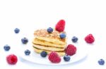 Pile Of Heart Shaped Pancakes With Blueberries And Raspberries Stock Photo