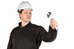 Handyman Wearing Uniform And Hardhat Stock Photo