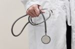 Doctor Holding Stethoscope Stock Photo