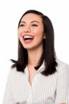 Corporate Lady Looking Up And Laughing Stock Photo