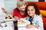 Mother And Daughter In A Restaurant Stock Photo