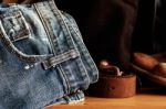 Old Jeans On Wooden Stock Photo