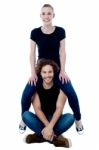 Girl Sitting On Boyfriend's Shoulders Stock Photo