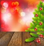 Wooden Floor With Christmas Tree On Red Bokeh Stock Photo