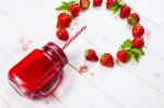 Strawberry Smoothie In Mason Jar With Straw Stock Photo