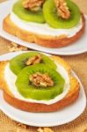 Toast With Kiwi, Cheese And Walnuts Stock Photo