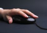 Female Hand Using Mouse Stock Photo