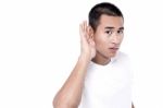 Young Man Listening Gossip Stock Photo