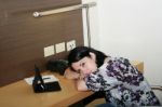 Young Businesswoman Leaning At The Office Stock Photo