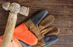 Old Hammer And Leather Gloves Stock Photo