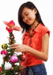 Girl Decorating Christmas Tree Stock Photo