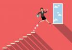 Business Woman Jumping To Success Stock Photo