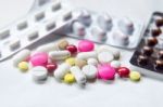 Top View Of The Pills On The White Background, Pack Of Tablet Drug And Capsule Pills On The Floor Stock Photo