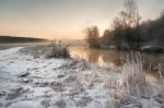 Winter Misty Dawn On The River. Rural Foggy And Frosty Scene Stock Photo