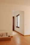 Empty Living Room With Wooden Floor And Some Boxes Stock Photo