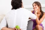 Man Hiding Fruit From Girl Stock Photo