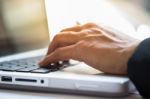 Close-up Of Typing Male Hands Stock Photo