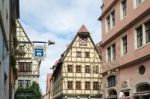 Various Hanging Signs In Rothenburg Stock Photo