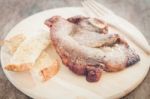 Pork Steak On Wooden Plate Stock Photo