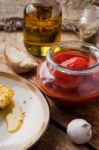 Canned Tomatoes In A Glass Jar Stock Photo