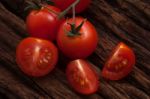 Organic Fresh Cherry Tomatoes On Wooden Background Stock Photo