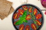 Baked Cherry Tomatoes With Basil And Thyme Stock Photo