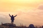 Young Man  Asia Tourist  At Mountain Is Watching Over The Misty Stock Photo