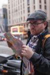 Hipster Young Man Looking The Map In A Urban Scene Stock Photo