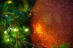 Close Up Big Red Glitter Ball Christmas On Tree With Wire White Light Background Stock Photo