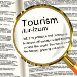 Tourism Definition Magnifier Stock Photo