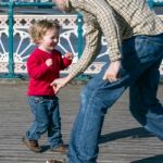 Cardiff Uk March 2014 - Family Playing On Penarth Pier Stock Photo