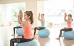 Asian Woman Doing Yoga Indoors Stock Photo