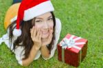 Santa Claus Hat With Red Christmas Gift Box Stock Photo