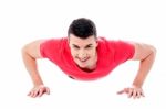 Young Man Doing Push-ups Stock Photo