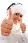 Happy Woman Listening To Music And Showing Thumbs Up Stock Photo