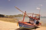 Fishing Boats Are Parked On The Beach Stock Photo