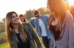 Portrait Of Group Of Friends Having Fun In Field Stock Photo