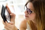 Pretty Young Woman Using Her Digital Tablet At Home Stock Photo