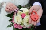 Couple's Hands Holding Wedding Lock Stock Photo