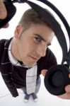 Handsome Man Holding Headphone Stock Photo