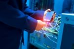 People Fix Node Fiber Optic In Network Room Stock Photo