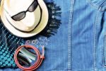 Top View Of Summer Accessories For Modern Woman On Denim Jean Ba Stock Photo