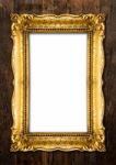 Old Gold Picture Frames On Wood Background Stock Photo