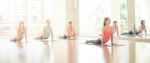 Asian Woman Doing Yoga Indoors Stock Photo