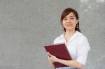 Portrait Of Thai Adult Businesswoman Beautiful Girl Read A Book Stock Photo