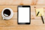 Tablet White Display And Coffee On Wood Workspace Stock Photo