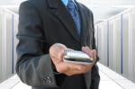 Businessman In Server Room Stock Photo